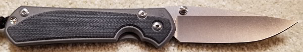 Chris Reeve Large Sebenza 31 Lefty. Black Canvas Micarta Inlay